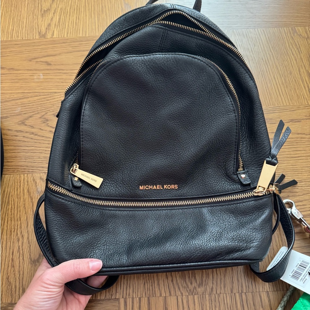 Michael Kors Black Leather Backpack. Very versatile!